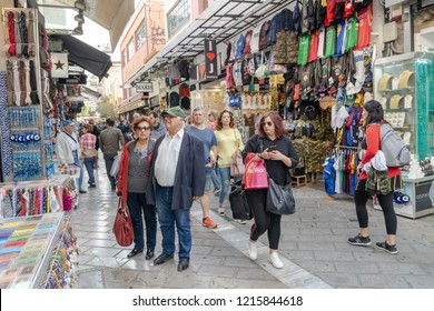 Athens, Greece - October 14, 2018: An Older Couple Goes Shopping In Monastiraki, A Neighborhood Known For Its Flea Market And Shopping Opportunities.