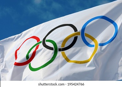 ATHENS, GREECE- OCTOBER 2, 2013: White Olympics Flag Against The Blue Sky In Athens, Greece.
