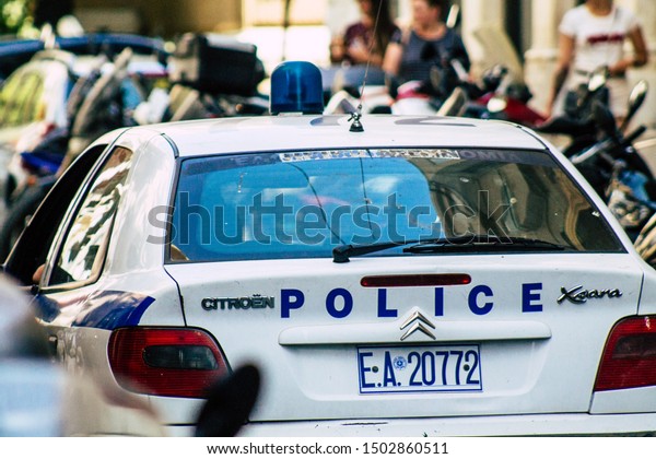 Athens\
Greece September 12, 2019 View of a Greek police car driving\
through the streets of Athens in the\
evening