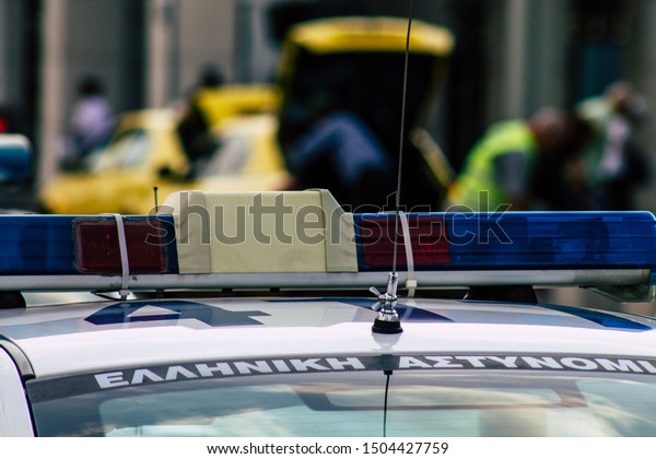 Athens\
Greece September 12, 2019 View of a Greek police car driving\
through the streets of Athens in the\
evening