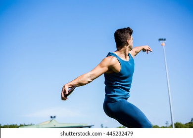 Athlete about to throw a discus in stadium - Powered by Shutterstock