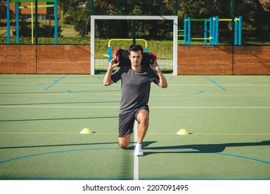 Athlete In Athletic Attire With A Barbell On His Back Performs A Lunge To Strengthen The Trunk And Lower Extremities. Strengthening The Thigh And Groin Muscles.