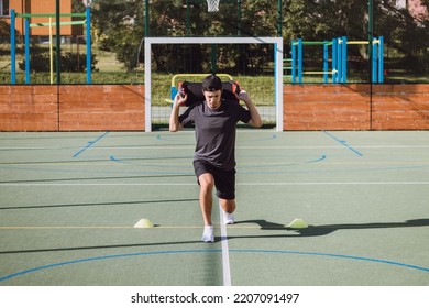 Athlete In Athletic Attire With A Barbell On His Back Performs A Lunge To Strengthen The Trunk And Lower Extremities. Strengthening The Thigh And Groin Muscles.