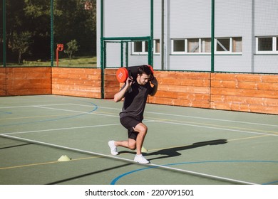 Athlete In Athletic Attire With A Barbell On His Back Performs A Lunge To Strengthen The Trunk And Lower Extremities. Strengthening The Thigh And Groin Muscles.