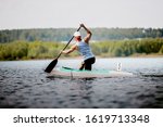 athlete canoeist rowing in lake. canoeing competition race