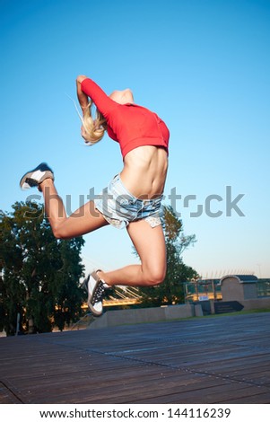 Similar – Unrecognizable women jumping over garden fence background