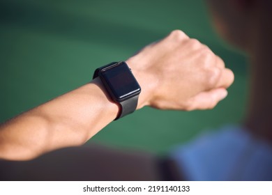 Athlete Checking Watch Time, Heart Rate And Step Count During Run, Exercise Or Jog Outdoors. Fit, Active And Healthy Woman Taking A Break To Monitor Progress While Training, Workout And Fitness