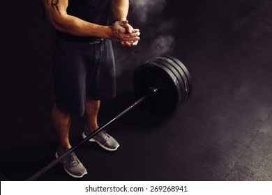 Athlete Clapping Hands With Talc Before Deadlift Barbells Workout