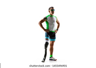 Athlete With Disabilities Or Amputee Isolated On White Studio Background. Professional Male Runner With Leg Prosthesis Training And Practicing In Studio. Disabled Sport And Healthy Lifestyle Concept.