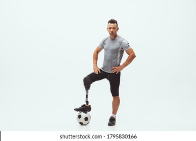 Athlete with disabilities or amputee on studio background. Football player - Powered by Shutterstock