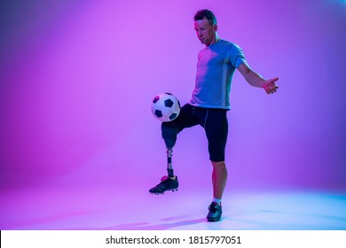 Athlete with disabilities or amputee on studio background. Football player - Powered by Shutterstock