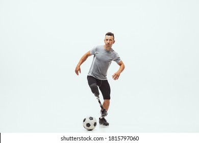 Athlete with disabilities or amputee on studio background. Football player - Powered by Shutterstock