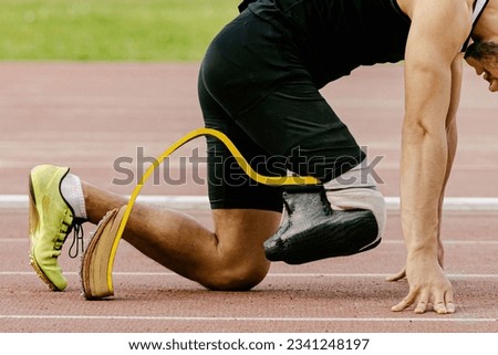athlete disability runner starting position in running sprint race, sports summer games