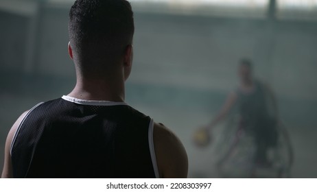 Athlete with disability spinning ball. Two disabled sport people  passing basketball training - Powered by Shutterstock