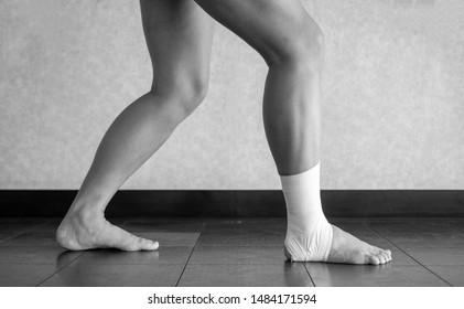  Athlete Doing A Calf Stretch With An Ankle Tape Job 