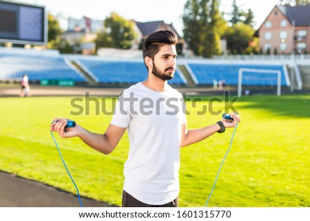 Athlete doing exercize at the stadium