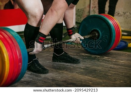 athlete exercise deadlift barbell weighing 300 kg
