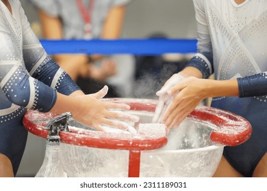 athlete gymnast gymnast chalking on hand - Powered by Shutterstock