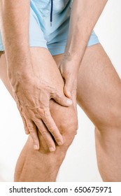 Athlete Man Feeling Pain To The Knee And The Quadriceps. It Could Be Iliotibial Band Syndrome Or Quadriceps Tendinopathy