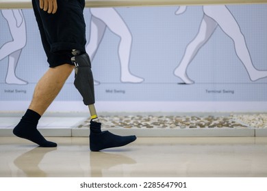 Athlete man with prosthetic leg walking at health care center - Powered by Shutterstock