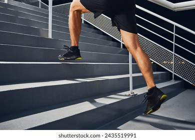 Athlete man running on stairs during interval training - Powered by Shutterstock