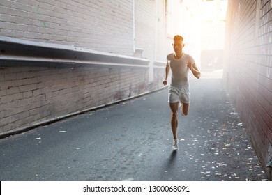 Athlete man running race. Mixed media