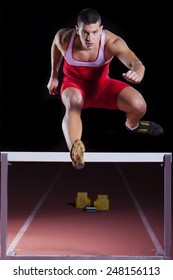 Athlete On Hurdle In Track And Field