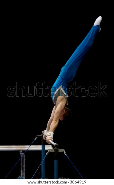 An athlete\
performing on the uneven\
bars