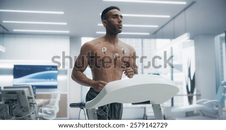 Athlete Performs Treadmill Exercise Test in a High-tech Medical Lab, Monitored by Sensors, Showcasing Advanced Fitness Evaluation and Health Monitoring