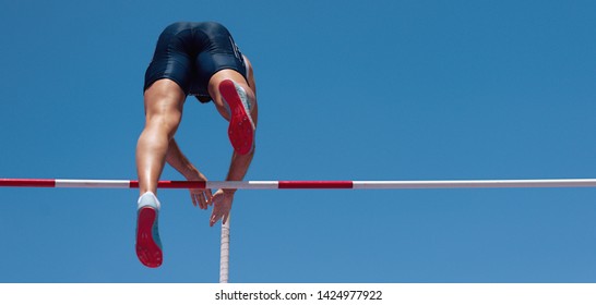 Athlete Pole Vault With A Blue Sky