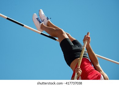 Athlete pole vault with a blue sky - Shutterstock ID 417737038