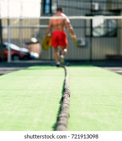 athlete pulls the rope