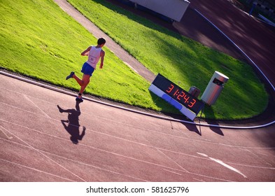 Athlete run on track during race