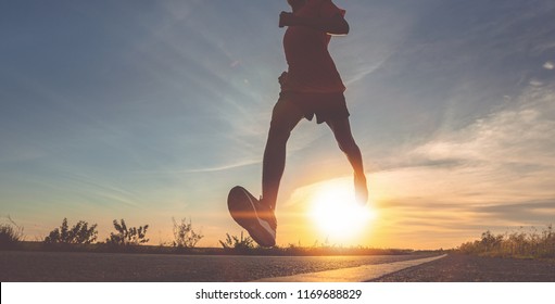 Athlete Runner Feet Running On Road