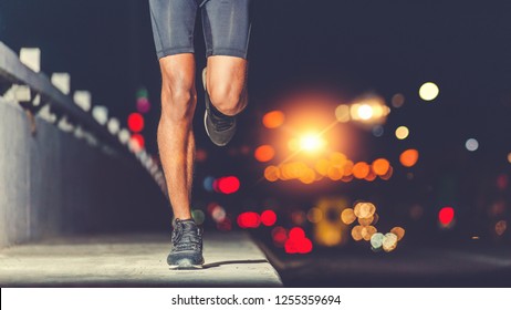 Athlete runner feet running on road, Jogging concept in the city - Powered by Shutterstock