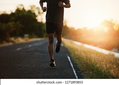Athlete runner feet running on road - Shutterstock ID 1271893855