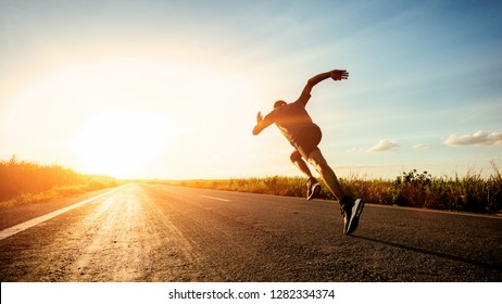 Athlete runner feet running on road - Shutterstock ID 1282334374
