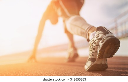 Athlete runner feet running on treadmill closeup on shoe