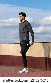 Athlete Running Male Runner During Sporty Fit Young Man Jogging by River Bank And Bridge As Jogger Training While Stretching.Vertical Shot - Shutterstock ID 2240275241