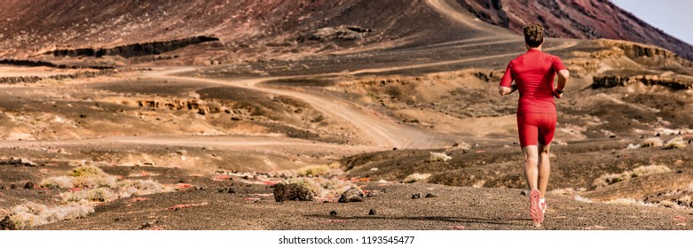 Athlete Running On Trail Path, Sports And Fitness Active Lifestyle. Man Runner On Long Distance Run Through Desert Summer Landscape. Banner Panorama Crop Of Mountain Background.