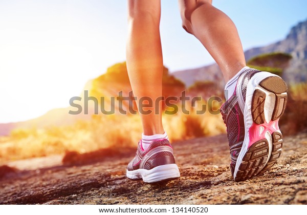 athlete running sport feet on trail healthy\
lifestyle fitness