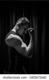 Athlete Shows Pumped Hand Close-up On A Black Background. Bodybuilding Mr. Olympia.