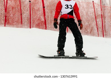 Athlete Snowboarder Riding On Track Snowboarding Competition