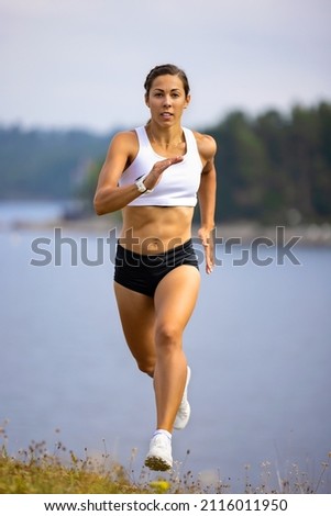 Similar – Fit muscular woman working out in a park