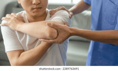 Athlete undergoing physiotherapy with a musculoskeletal specialist after sports and gym injuries. - Powered by Shutterstock