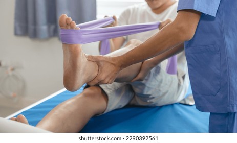 Athlete undergoing physiotherapy with a musculoskeletal specialist after sports and gym injuries. - Powered by Shutterstock