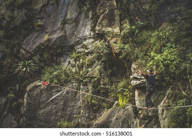 Athlete walking in highline, slackline, tight rope sourrounded by nature - Shutterstock ID 516138001