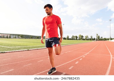 Athlete warming up by stretching before exercise. man doing stretching exercises before exercise - Powered by Shutterstock