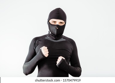 An athlete wearing a sweatshirt and mask. The concept of playing sports, extreme sport. Putting on the necessary protective clothing. - Powered by Shutterstock