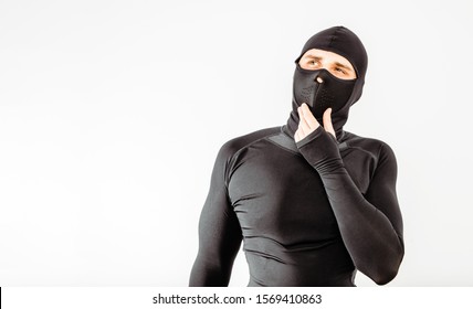 An athlete wearing a sweatshirt and mask thinks. The concept of playing sports, extreme sport. Putting on the necessary protective clothing. - Powered by Shutterstock